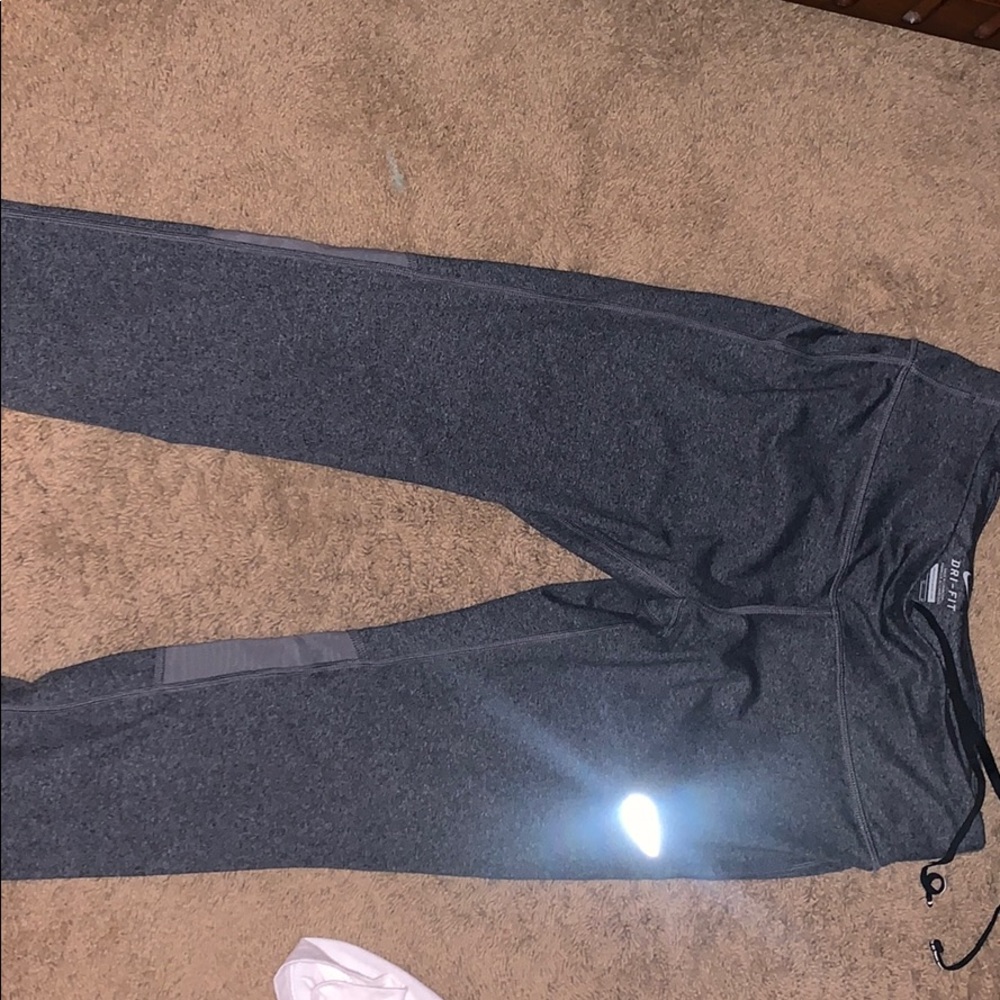 Grey Nike running tight